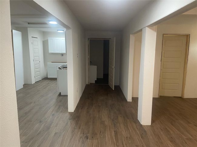 Hall with dark wood-style flooring | Image 4