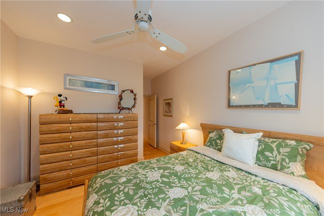 Guest Bedroom 2 featuring recessed lighting, ceiling fan, lofted ceiling, and light wood-style floors | Image 44