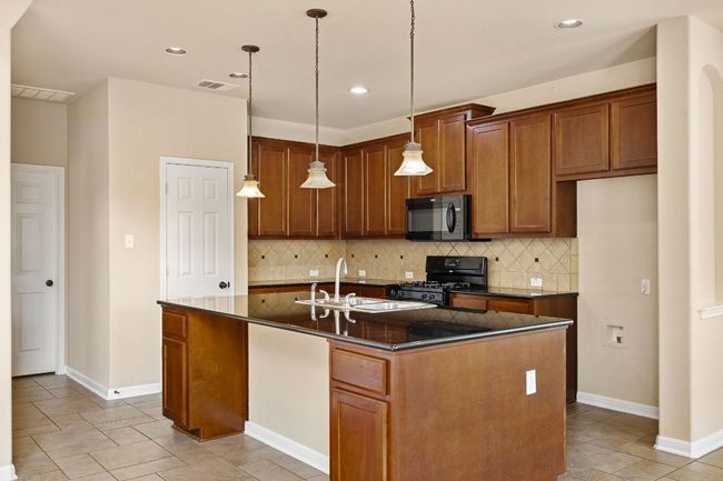 Kitchen with plenty of storage and counter space | Image 12
