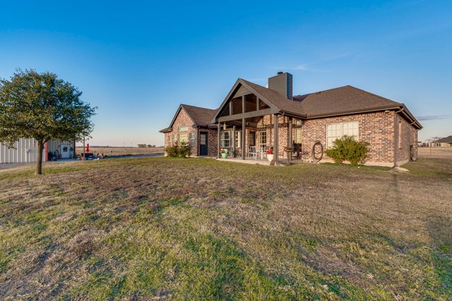 Back of house featuring a large covered patio and a lawn | Image 26
