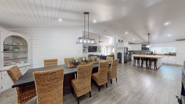 Dining space with sink, a wood stove, crown molding, and hardwood / wood-style floors | Image 9