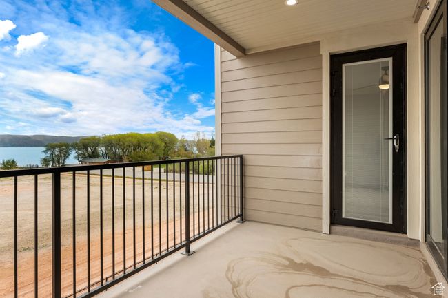 Balcony featuring a water view | Image 13