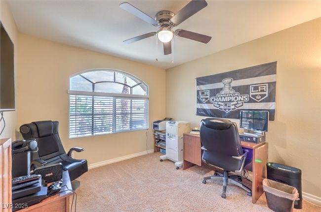 Carpeted office with ceiling fan and baseboards | Image 8