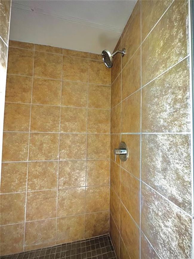Bathroom with a tile shower | Image 10