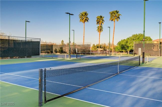 View of sport court featuring community basketball court and fence | Image 31