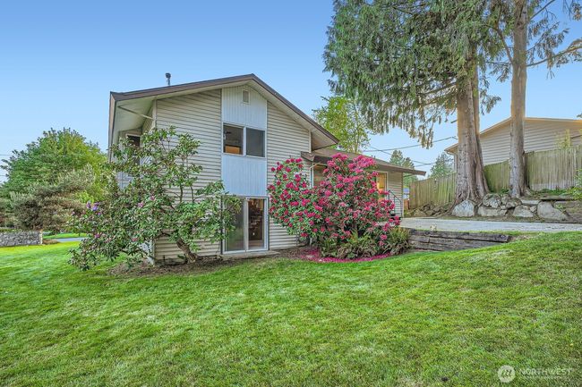Large corner lot, view from shed and green house of back and side yard areas. | Image 34