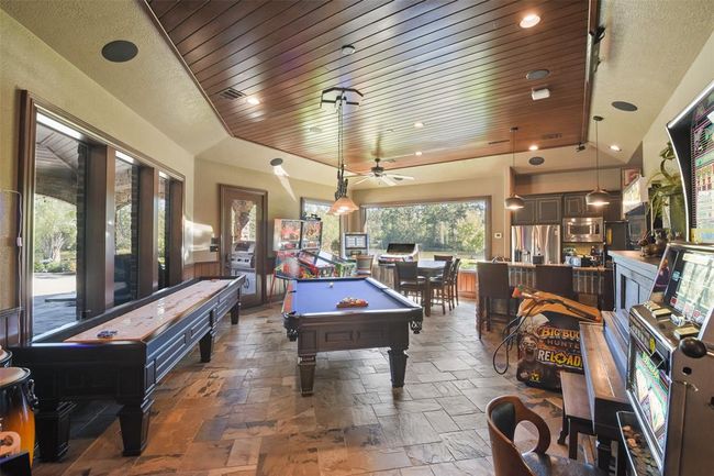 The game-room has a kitchen and bar and easily accommodates multiple gaming machines and regulation style pool table | Image 21