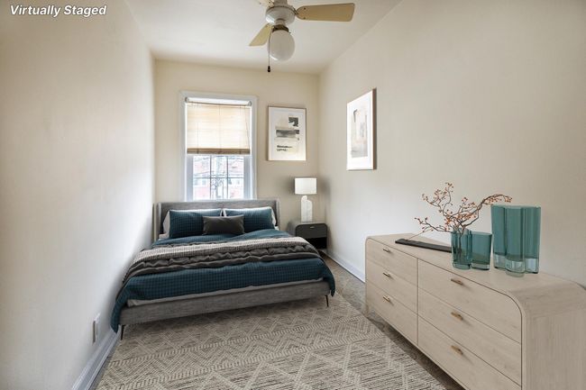 Bedroom featuring a ceiling fan, light carpet, and baseboards | Image 14