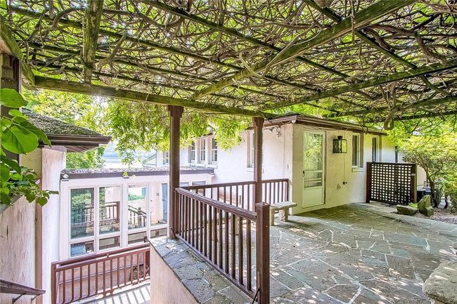 The exterior window trim in the low breezeway was virtually painted. | Image 35