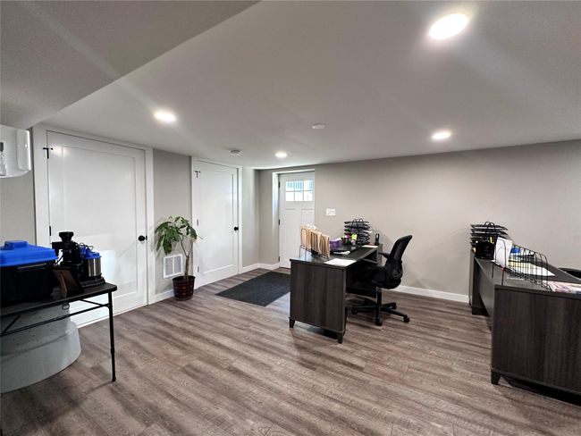Office space featuring wood finished floors and recessed lighting | Image 14