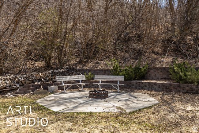 View of patio / terrace featuring an outdoor fire pit | Image 44