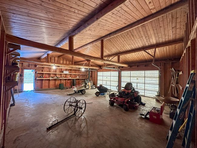 Garage featuring wood ceiling | Image 43