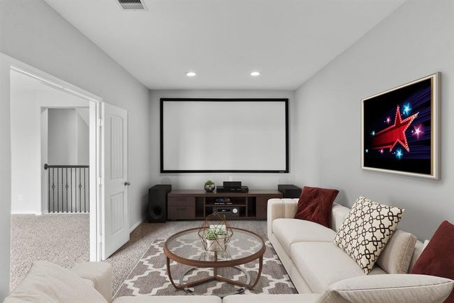 Virtually Staged: No need to go to the movie theater with this fantastic media room! It is complete with plush carpet and recessed lighting. | Image 19