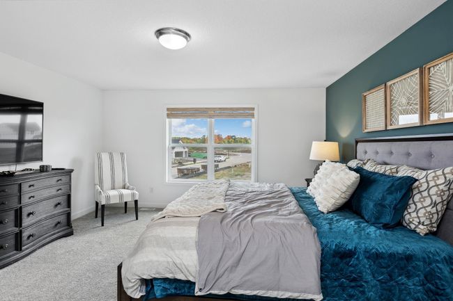 Photo is of the actual model. Another view of the primary bedroom. | Image 15