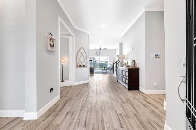 Ensuite bedroom and private home office located on left side of the home | Image 13