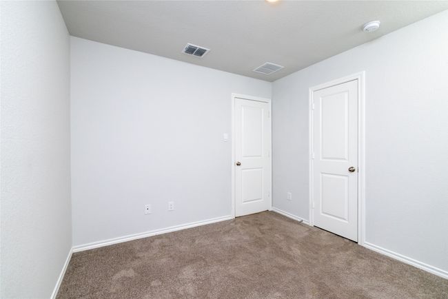 Unfurnished bedroom with carpet floors and baseboards | Image 27