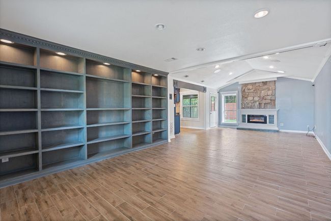 Flexible layout and built-ins offer a world of choice. Owners used this front space as gallery/dining room. | Image 6
