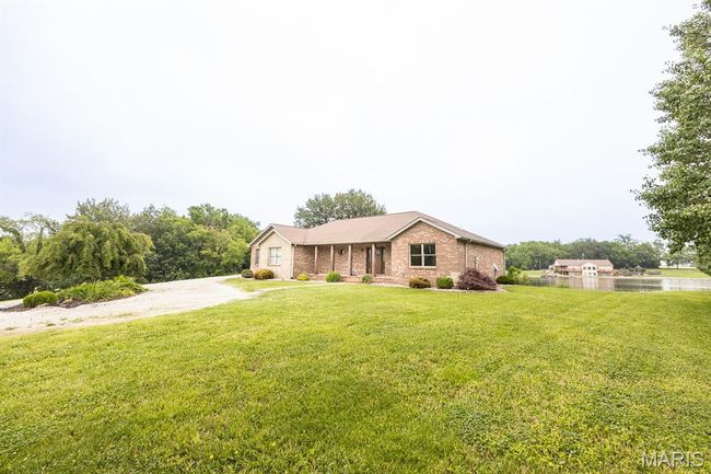 Ranch-style home featuring a front lawn and brick siding | Image 8