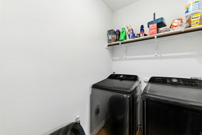 Laundry room featuring washing machine and clothes dryer | Image 20