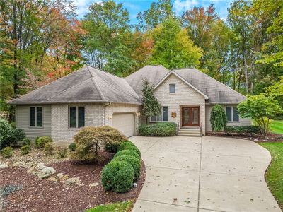 View of front facade featuring a garage | Image 1