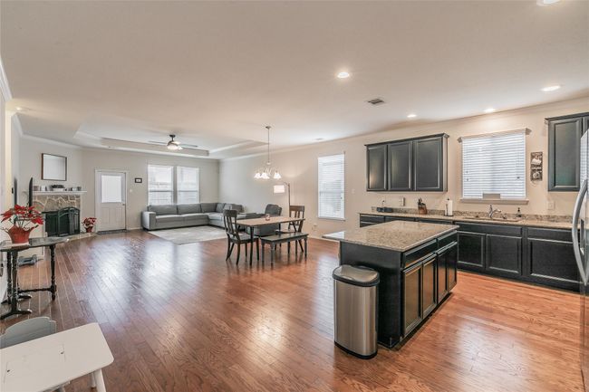 open kitchen with light stone counters | Image 19