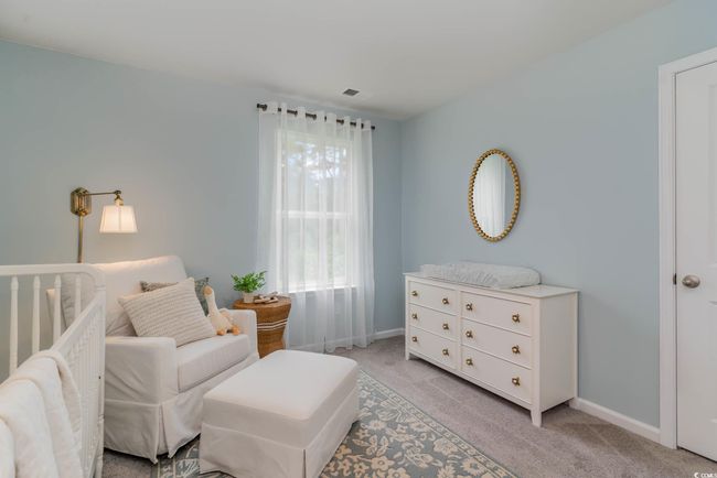 Sitting room featuring light colored carpet and baseboards | Image 24