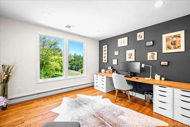 Office with a baseboard radiator, wood finished floors, and recessed lighting | Image 21