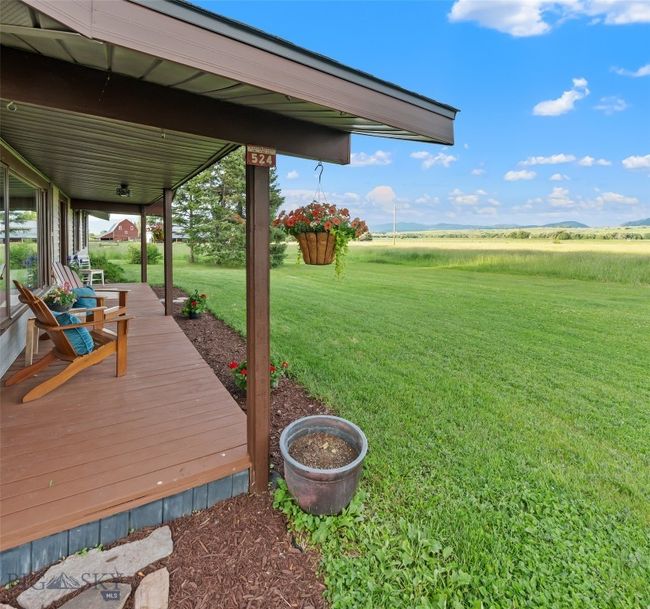 Wonderful covered front porch looking east to Abigail Ranch | Image 7