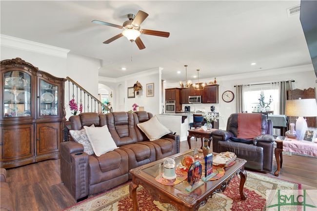 Family Room with views of the Breakfast Room, kitchen and ornate staircase | Image 17