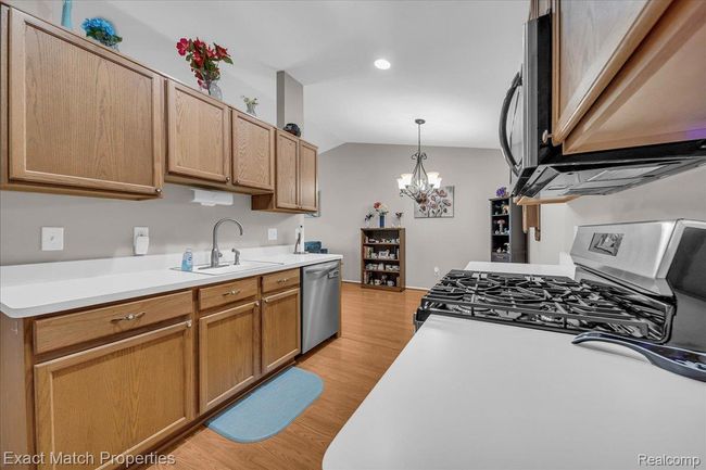 Kitchen overlooks the dining area. | Image 21