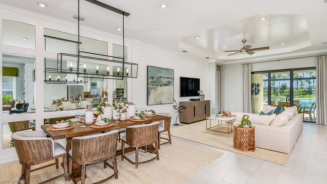 Tiled dining area featuring ornamental molding, visible vents, recessed lighting, and ceiling fan with notable chandelier | Image 7
