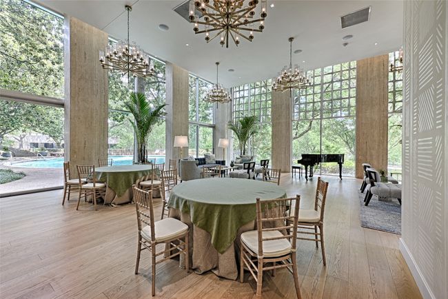 Turtle Room for resident use with dining area with a chandelier, a towering ceiling, a wall of windows, and light wood flooring | Image 26