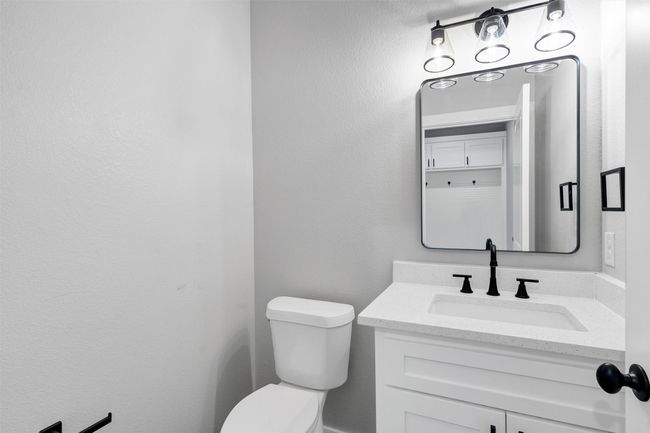 Half bathroom featuring toilet and vanity | Image 20