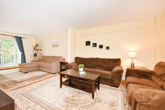 Living room featuring wood finished floors | Image 9