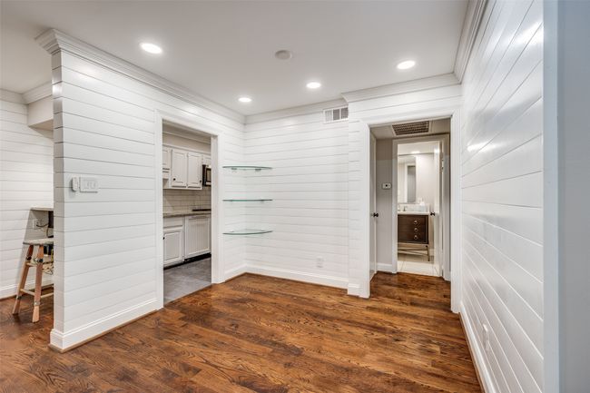 Unfurnished bedroom featuring dark wood-type flooring, ensuite bath, and recessed lighting | Image 6