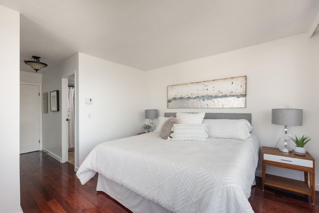 Bedroom featuring wood finished floors | Image 23