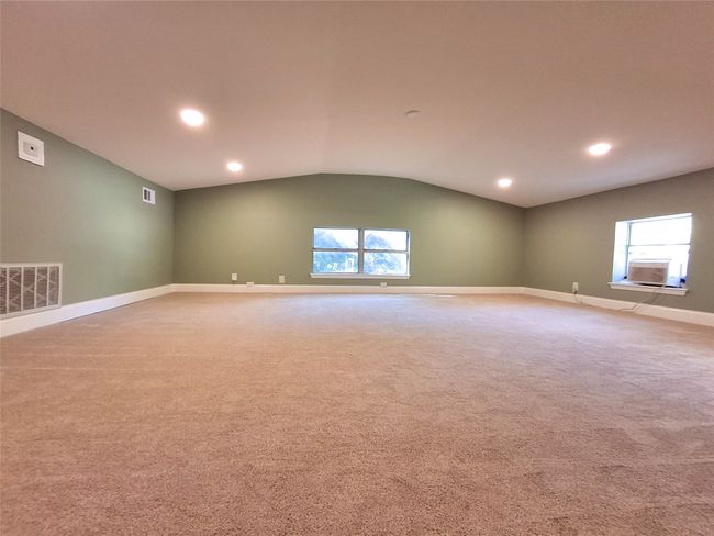 Carpeted Bonus room with lofted ceiling, healthy amount of natural light, baseboards, cooling unit, and recessed lighting | Image 10