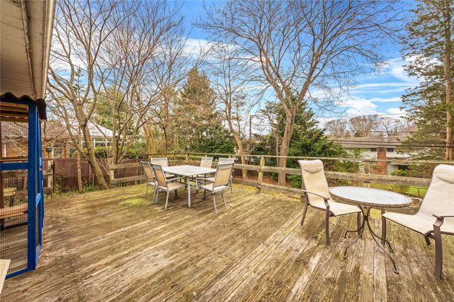 Deck with fence and outdoor dining area | Image 11
