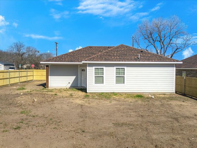 Back of property with a shingled roof and a fenced backyard | Image 29