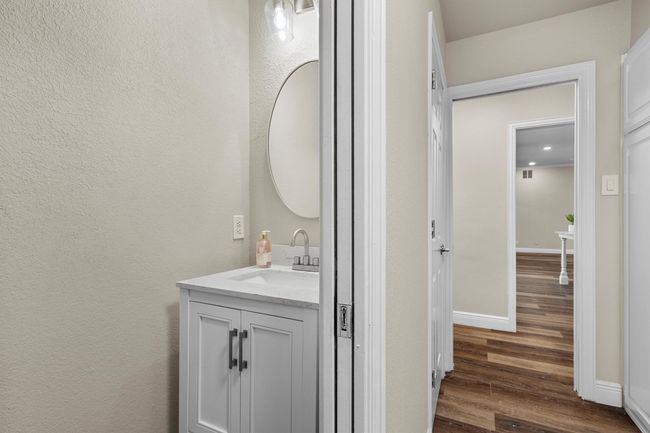 There is a half bath off of the laundry room for guests on this side of the house. | Image 18