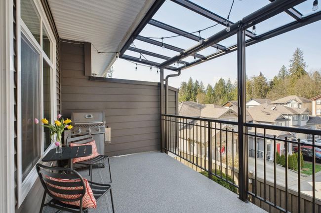 Balcony featuring grilling area and a residential view | Image 26