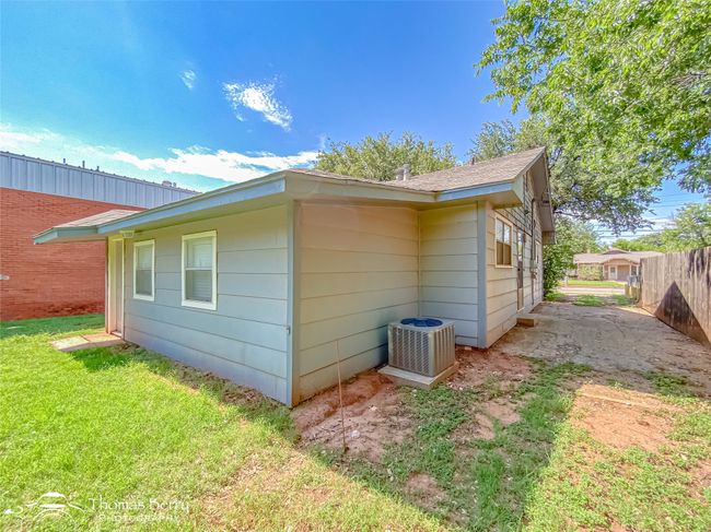 View of home's exterior featuring a central AC unit | Image 34