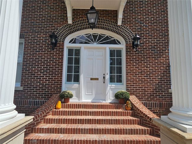 Entrance to property featuring brick siding and crawl space | Image 30