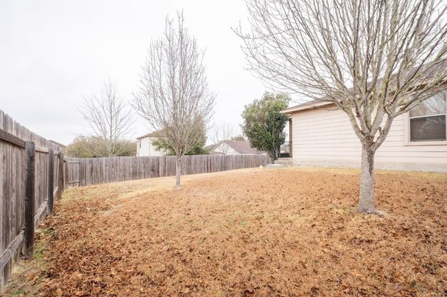View of fenced backyard | Image 27