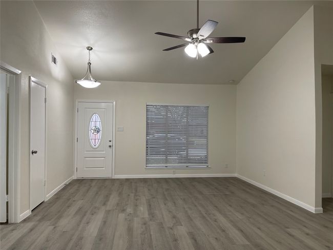 Foyer entrance with ceiling fan, lofted ceiling, and light wood-type flooring | Image 13