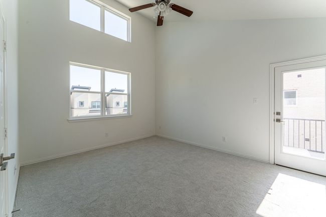 Carpeted spare room featuring baseboards and a ceiling fan | Image 10