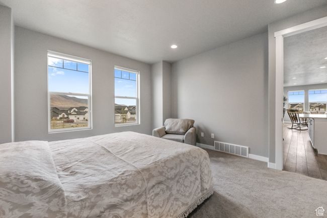 Bedroom featuring baseboards, visible vents, recessed lighting, and carpet flooring | Image 20