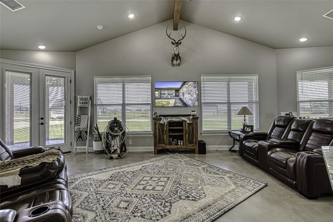 Living area with ceiling fan & beam ceiling | Image 4