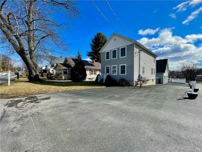 View of property exterior featuring a yard | Image 2