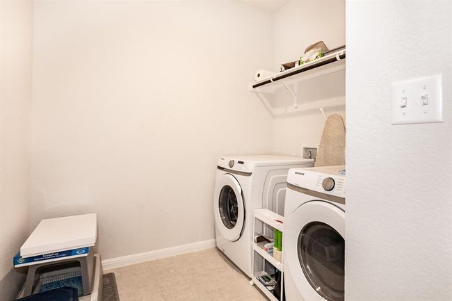 Laundry area with washer and dryer and baseboards | Image 18